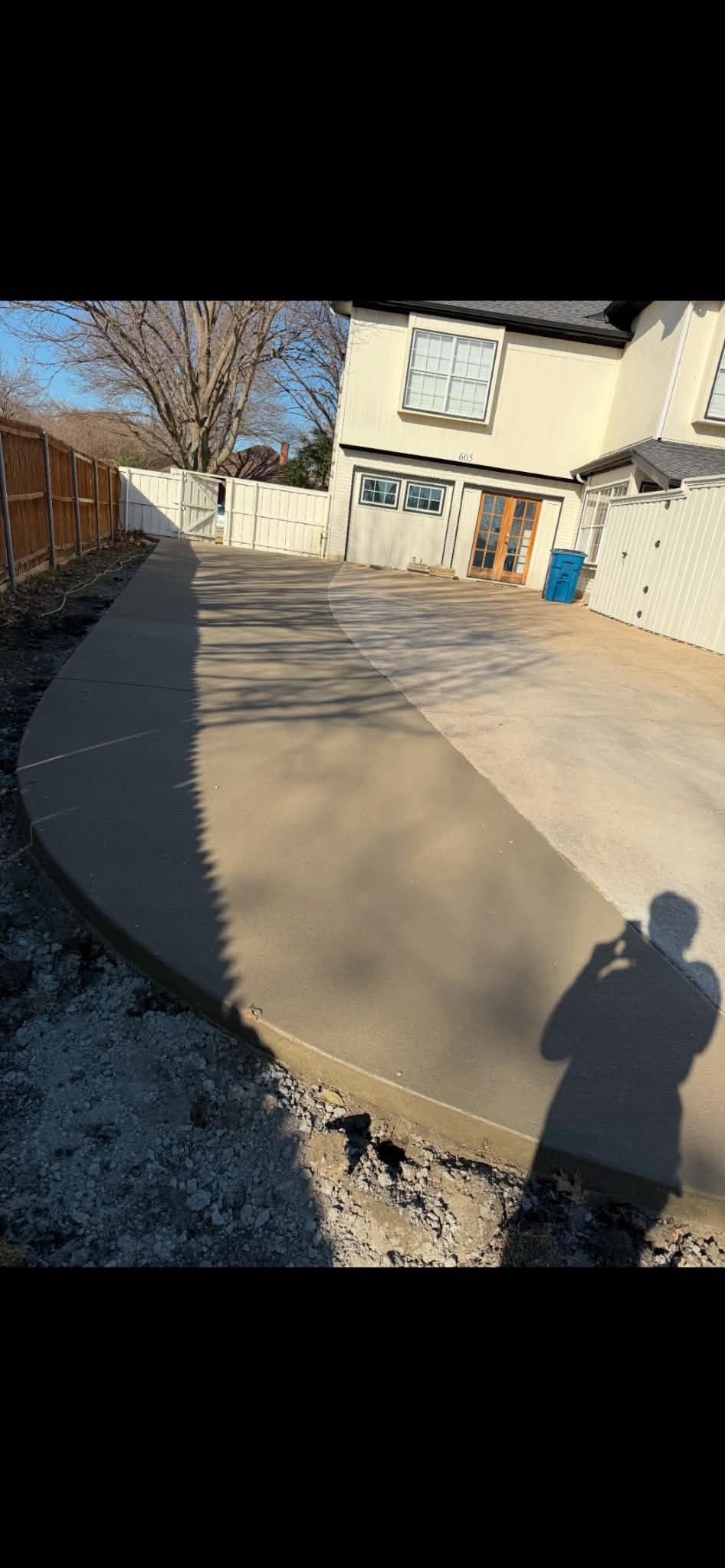Curved concrete driveway extension
