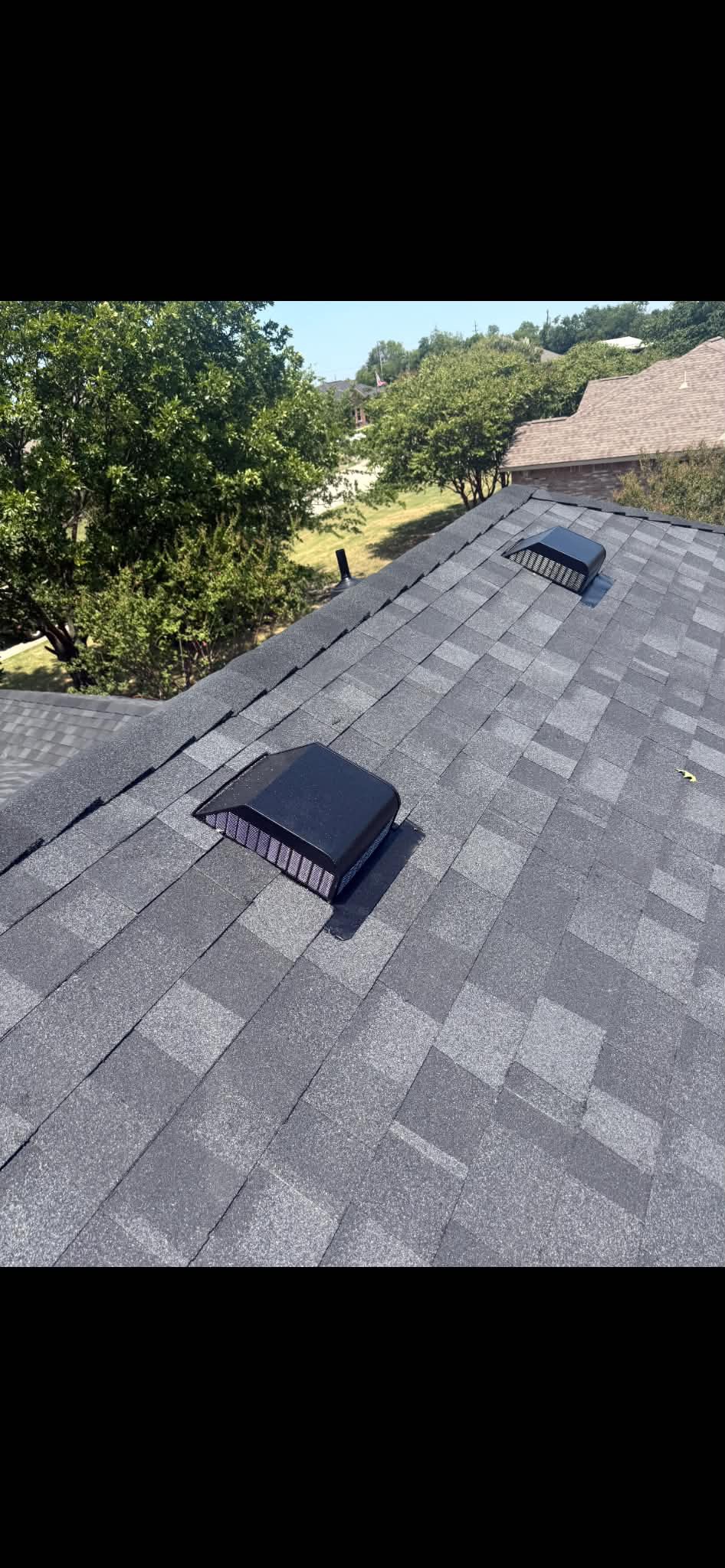 Completed roof replacement with new ridge vents